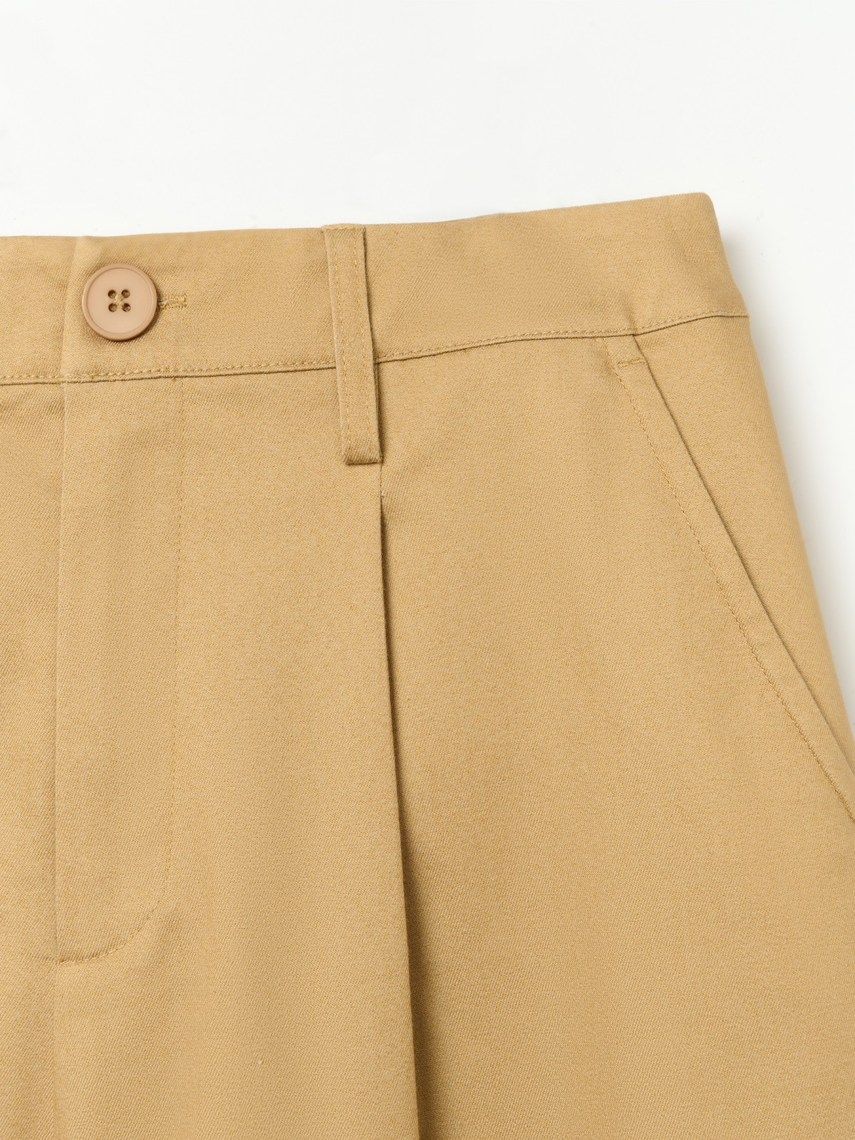 Брюки фасона Carrot с защипами